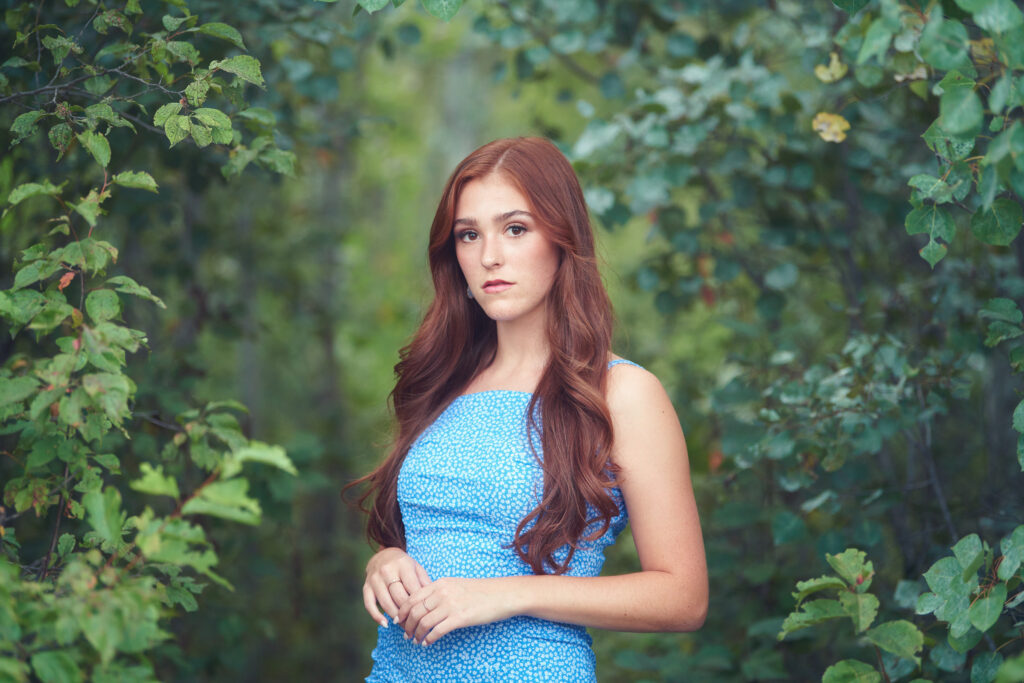 High School Senior Portrait Photographer in Lush Forest Landscape