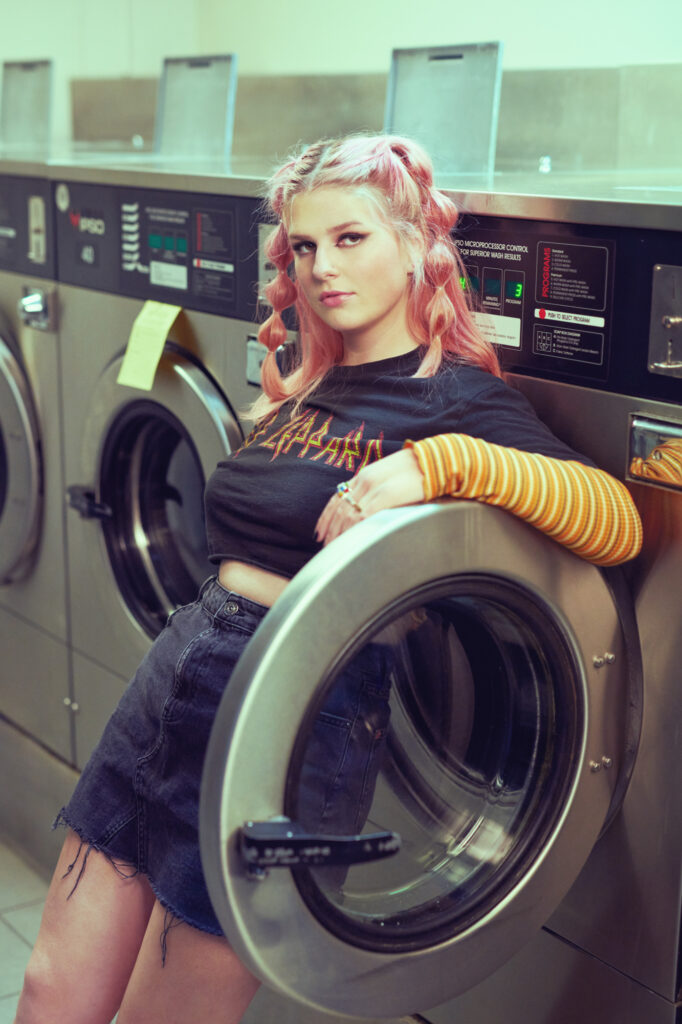 High School Senior Portrait of Stylish Teen in Laundromat Setting 35
