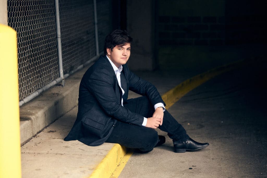 Senior picture of woodbury guy posing downtown for editorial looks